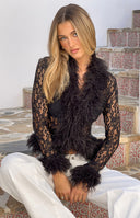 Black lace top with shaggy fur trim on the deep V-neckline, cuffs, and hem