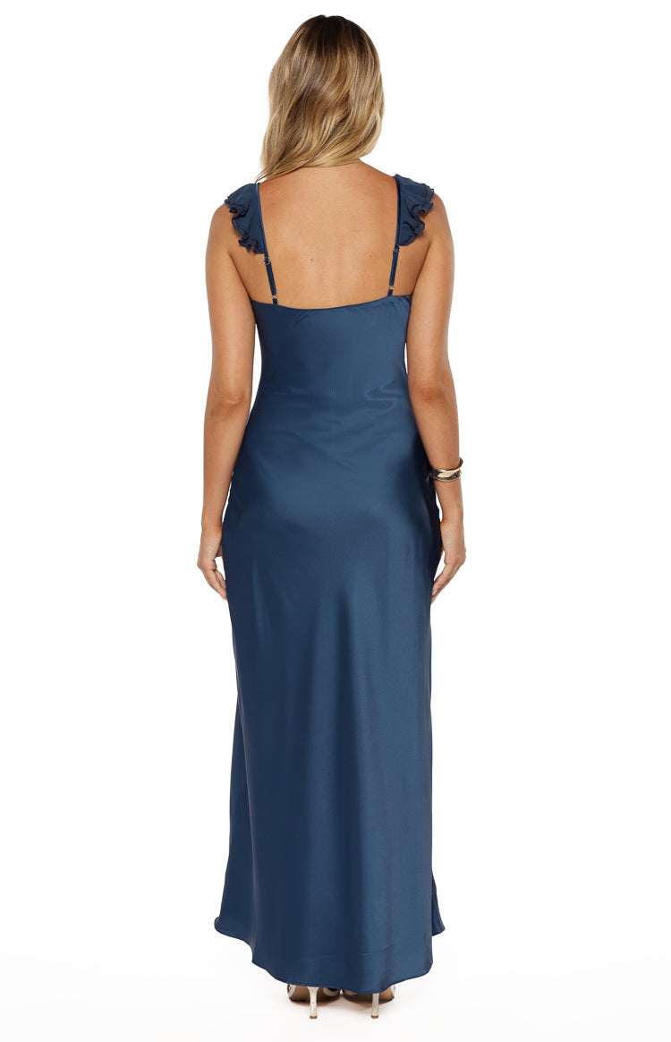 Rear view of a navy satin maxi dress with a low scoop back and ruffled spaghetti straps