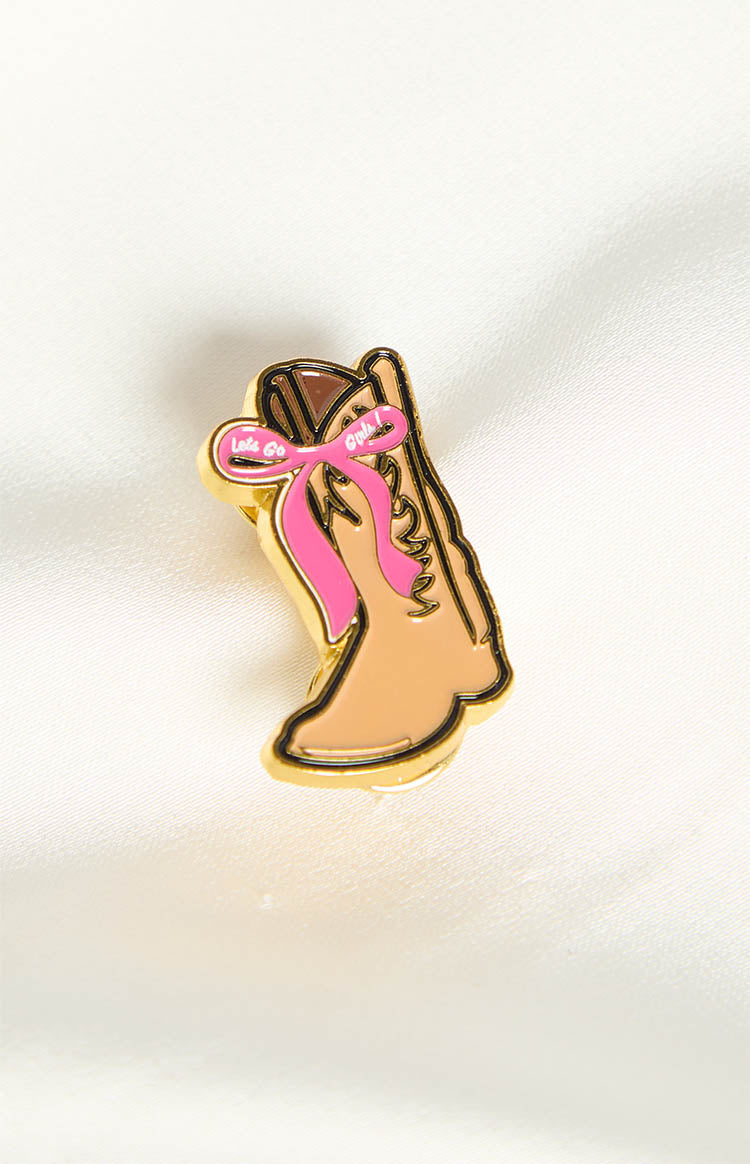 Tan cowboy boot pin with gold outline and a pink ribbon detail that reads 'Let's Go Girls!'