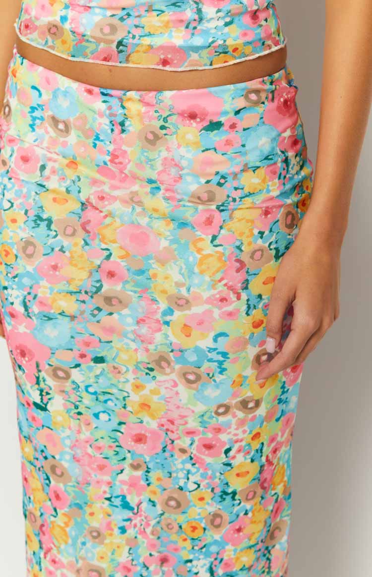Close-up of the multi floral maxi skirt showing the ruched side detail and vibrant pattern