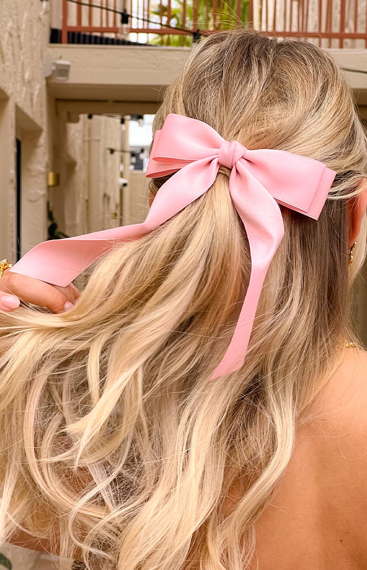 Smooth pink satin bow hair clip with long ribbon tails