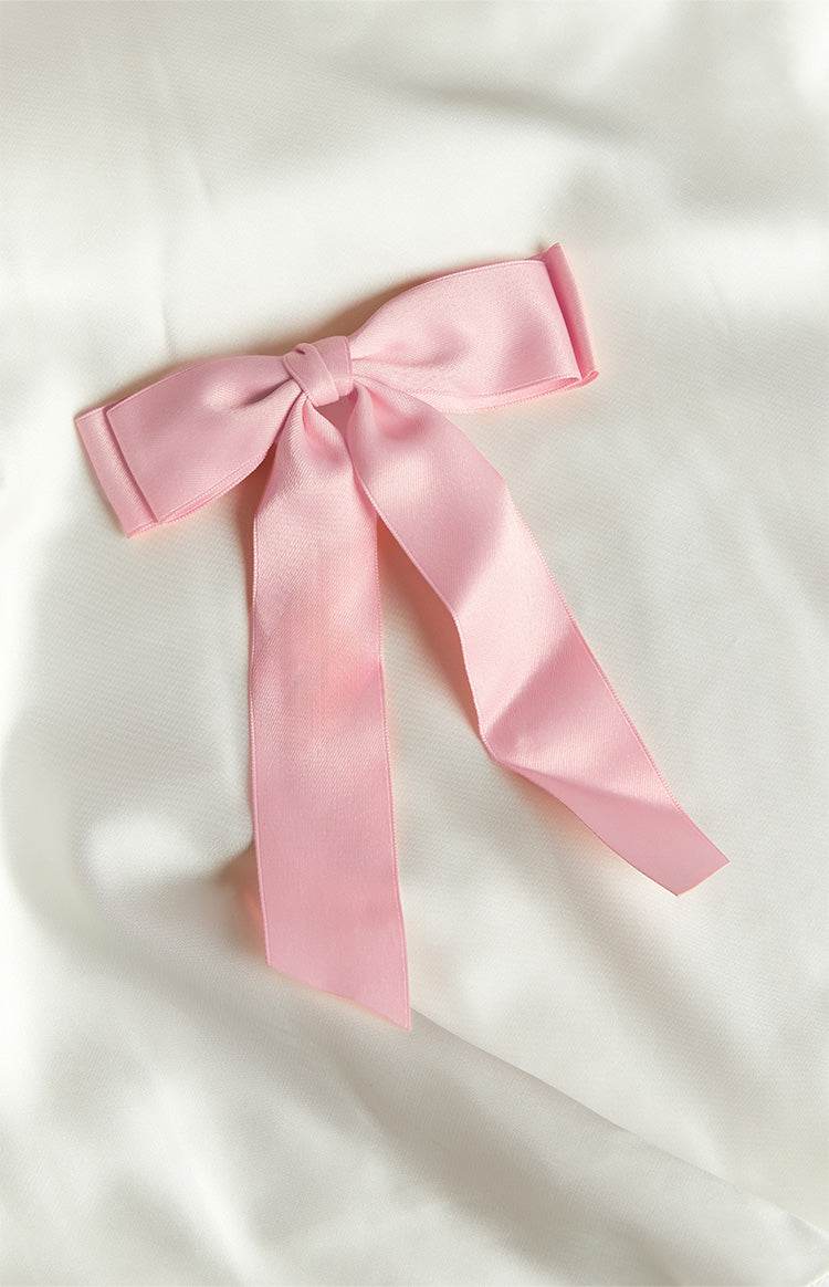 Pink satin bow with a central knot and two long flowing tails