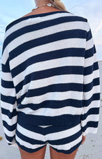 Rear view of navy and white striped knit shorts, highlighting the soft texture and curved leg hem
