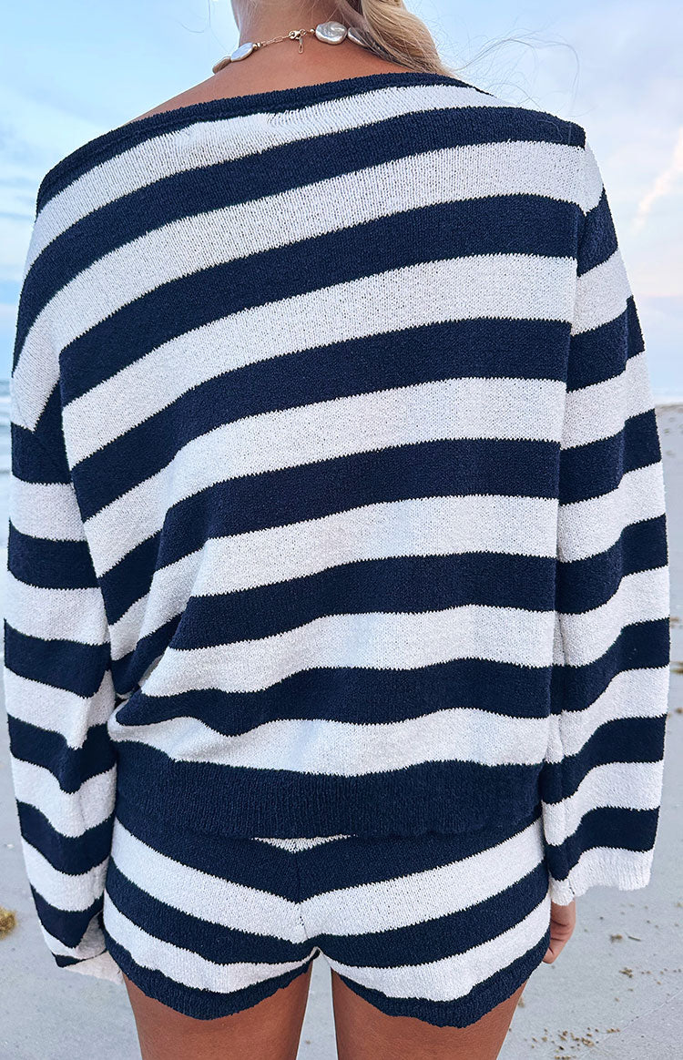 Rear view of navy and white striped knit shorts, highlighting the soft texture and curved leg hem