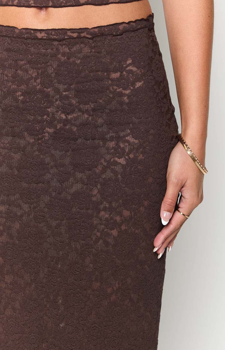 Close-up of the brown lace midi skirt, highlighting the sheer floral pattern and ruffled waist