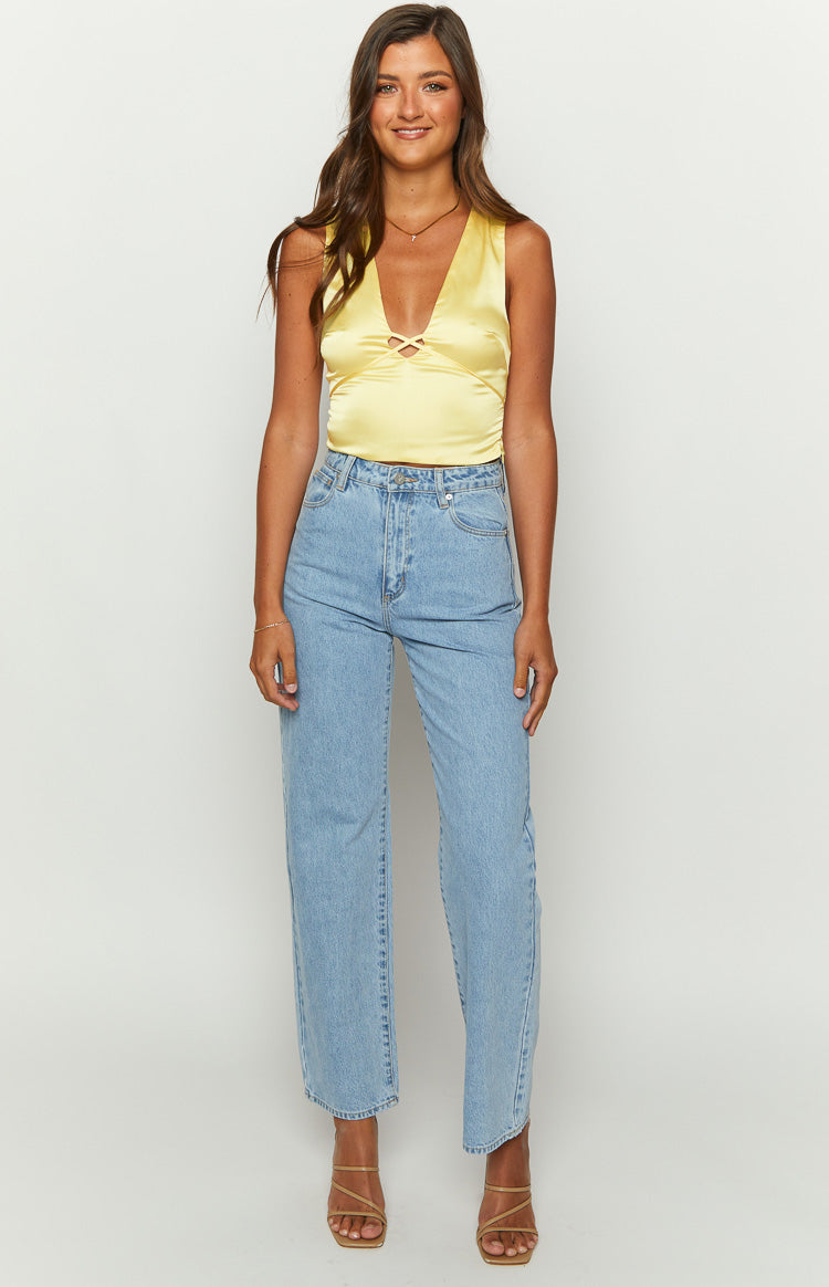 Daffodil yellow satin top with deep V-neckline and criss-cross bust detail