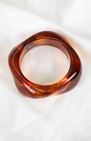 The Zantie Tortoiseshell Resin Square Bangle a timeless accessory to elevate any outfit.