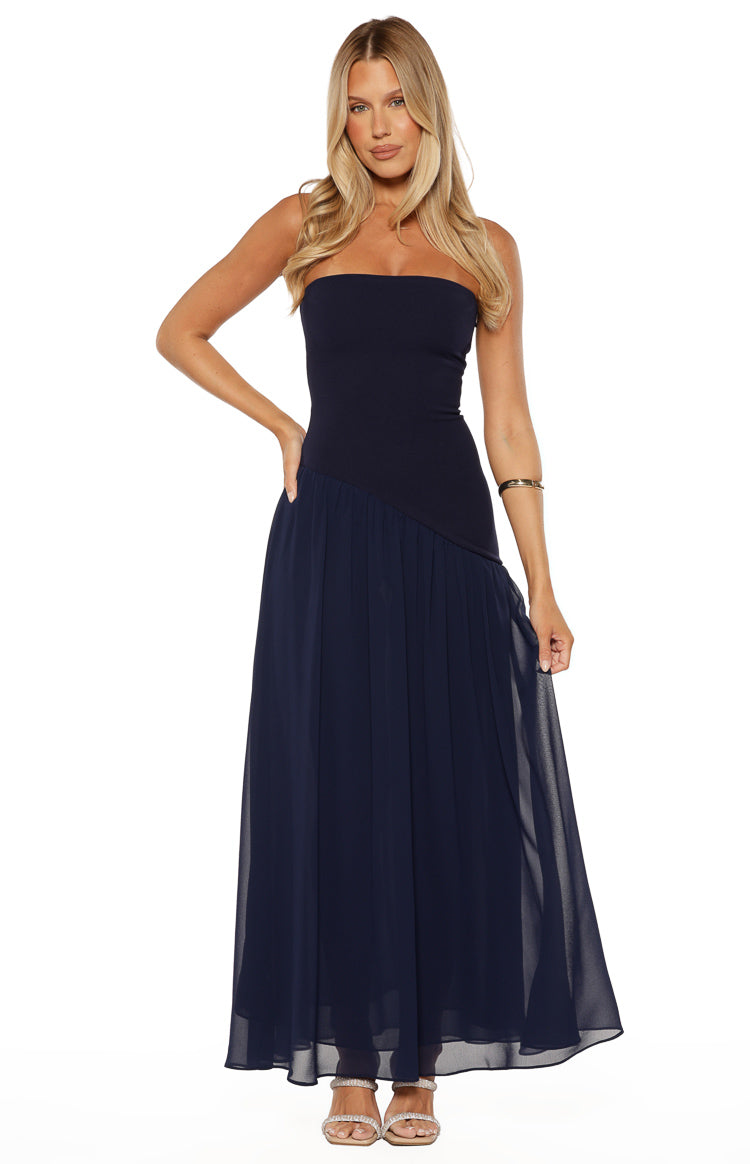 Beginning Boutique Zelia Strapless Navy Maxi Dress navy strapless fitted bodice with diagonal seam and flowy pleated chiffon maxi skirt