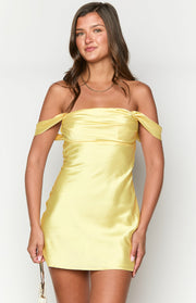 Front view of a yellow satin off-the-shoulder mini dress with a fitted bodice and draped sleeves
