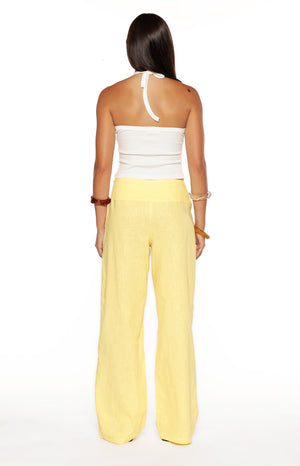 Rear view of yellow wide-leg pants with a wide high-waisted band and relaxed fit