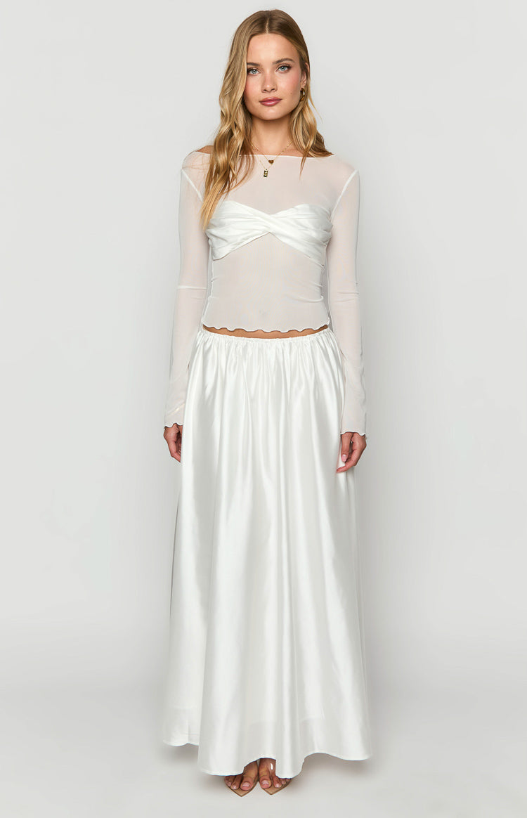 White sheer long sleeve top with a twisted satin bust detail and scalloped hem