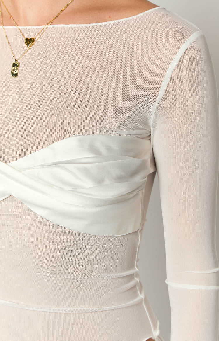 Close-up showing the sheer white mesh fabric and the twisted satin panel detail across the bust