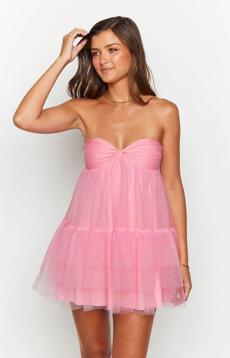 Close-up front view of a pink strapless mini dress with a twisted sweetheart neckline and tiered tulle