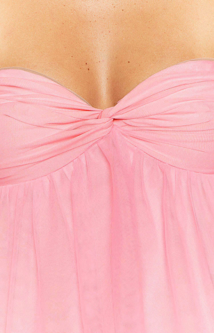 Close-up of the pink strapless mini dress showing the twisted knot bust detail and sheer ruched fabric