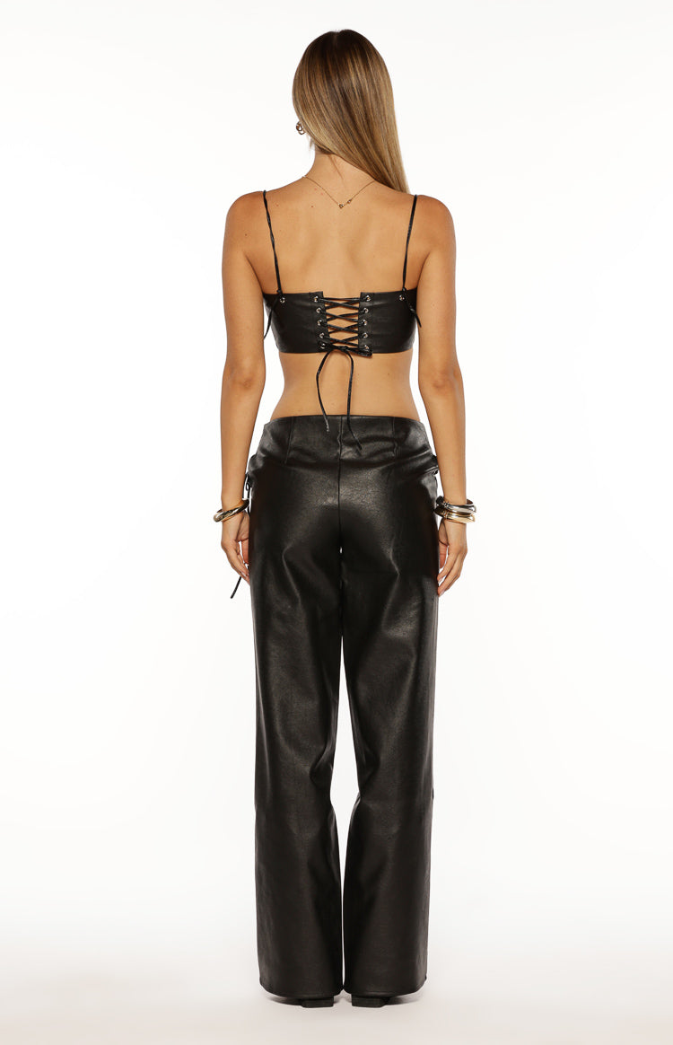 Rear view of black PU leather wide-leg pants with a smooth high waist