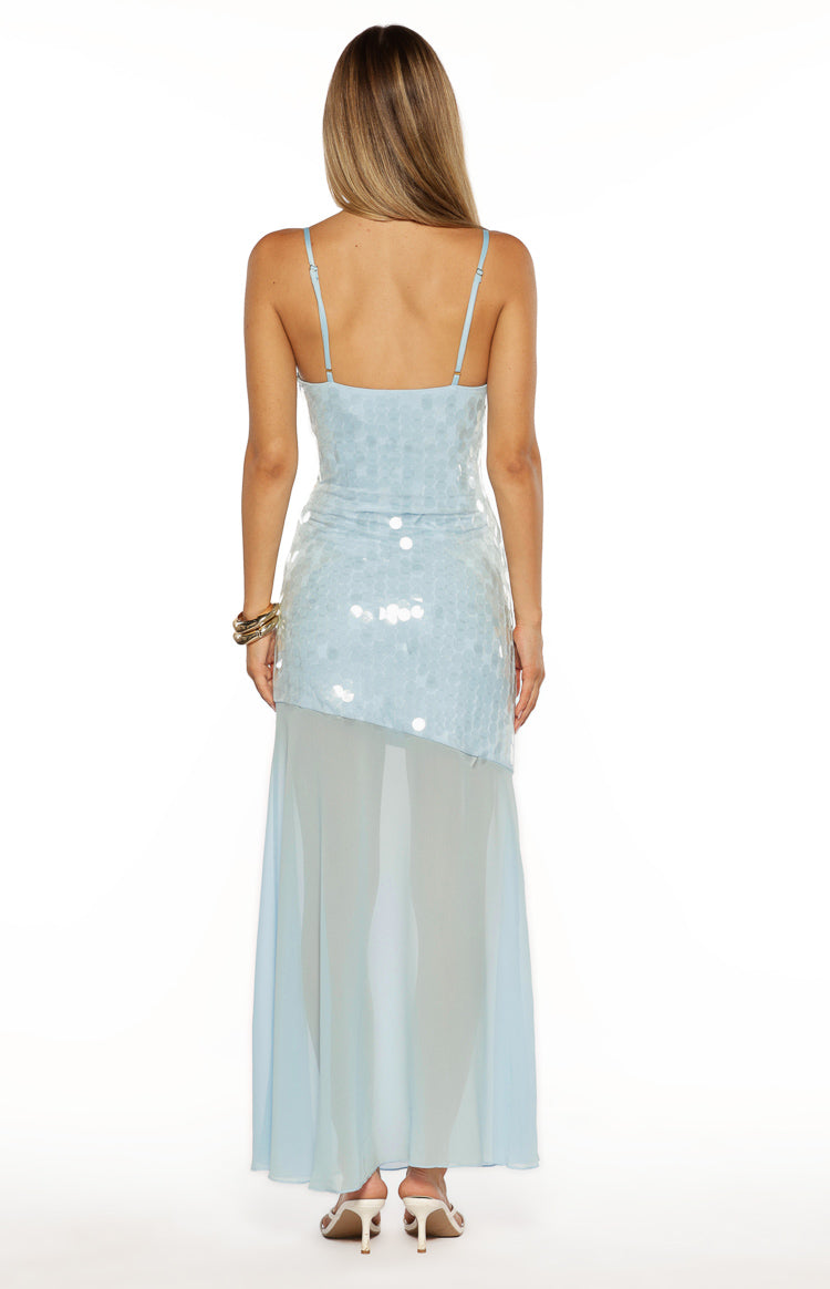 Rear view of the light blue sequin maxi dress with thin straps, asymmetrical sequin overlay, and sheer skirt