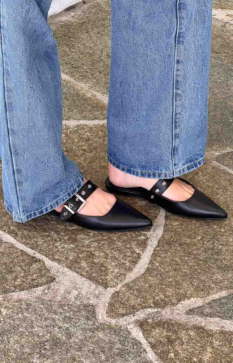 Beginning Boutique Billini Halsy Black Mules black pointed toe mules with a wide buckled strap and silver stud details