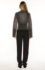 Back view of a black washed denim biker jacket with vertical seam details and a cropped hemline