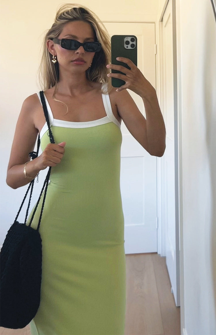 Full length view of a lime green ribbed knit maxi dress with white contrast trim on the square neckline and straps