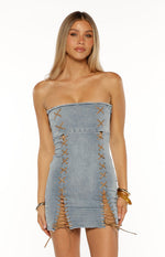 Light wash denim strapless mini dress with brown criss-cross lacing creating cutouts on the front and sides