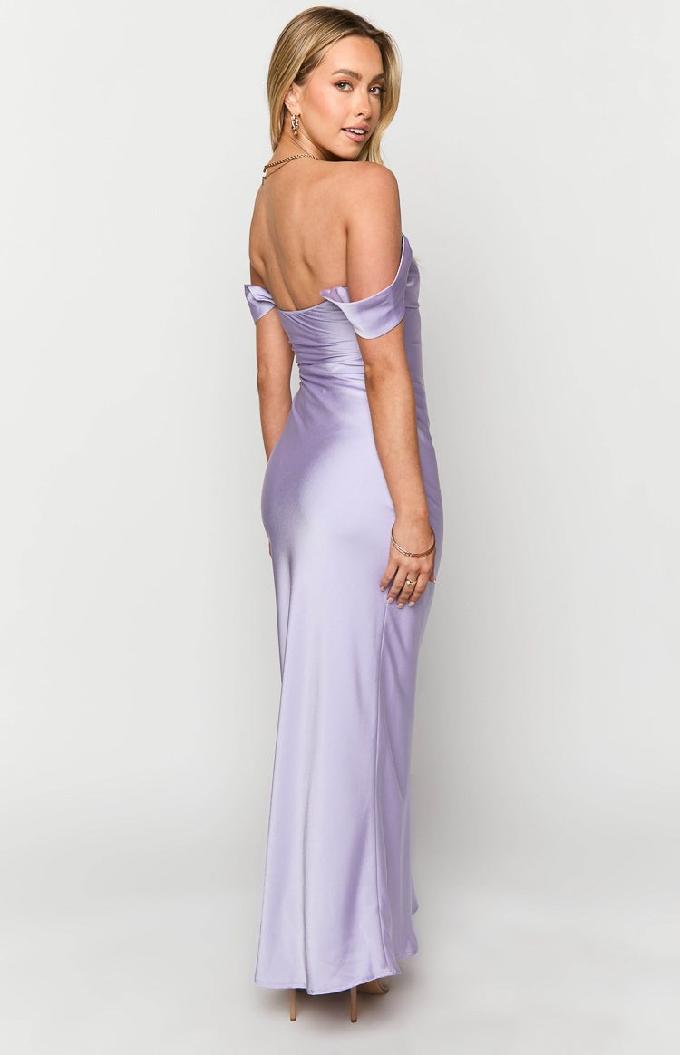 Side view of a lilac off-shoulder maxi formal dress with a fitted bodice and flowing skirt, showing the bare back