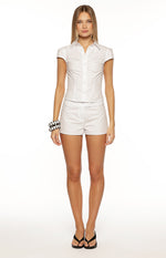 White low rise tailored shorts with a flat front and short length