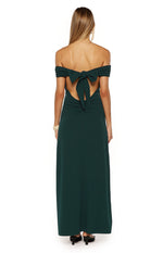 Back view of the teal crepe off-the-shoulder maxi dress with a large bow tie, open back cutout, and ruched lower back