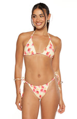 Front view of yellow and pink floral print bikini bottoms with ruched front and beaded tie sides