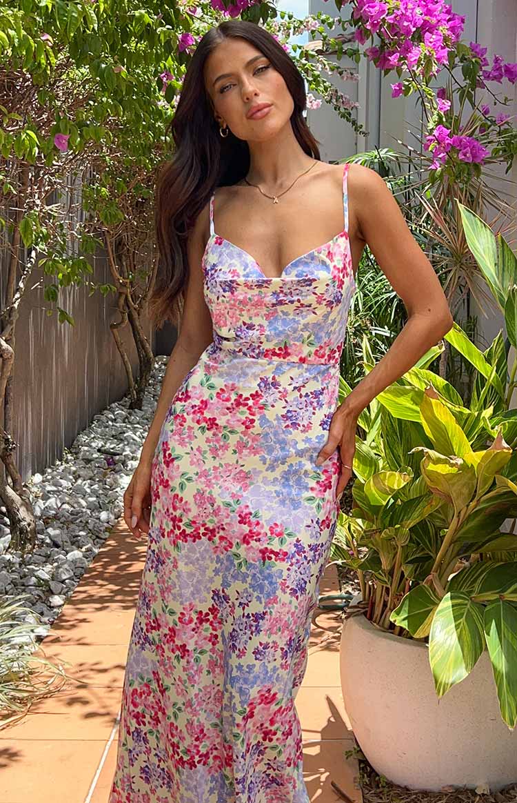 Yellow floral print maxi dress with a draped cowl neckline and delicate spaghetti straps