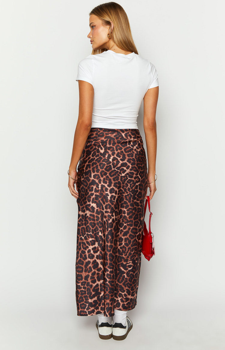 Back view of the brown and black leopard print maxi skirt showing its full length and flowing drape