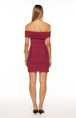 Rear view of a burgundy off-shoulder mini dress with draped neckline and lettuce hem