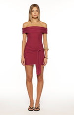 Front view of a heather burgundy off-shoulder mini dress with a ruched neckline and front wrap tie detail