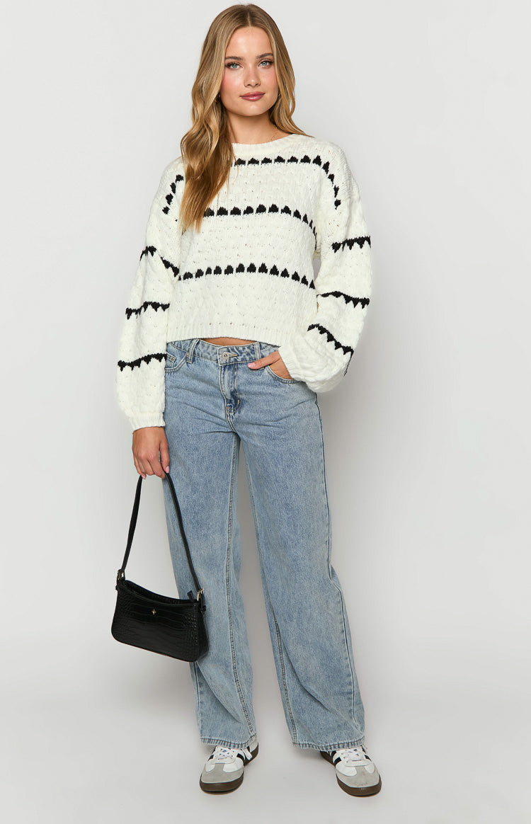 White cropped sweater with black heart stripe pattern and long sleeves