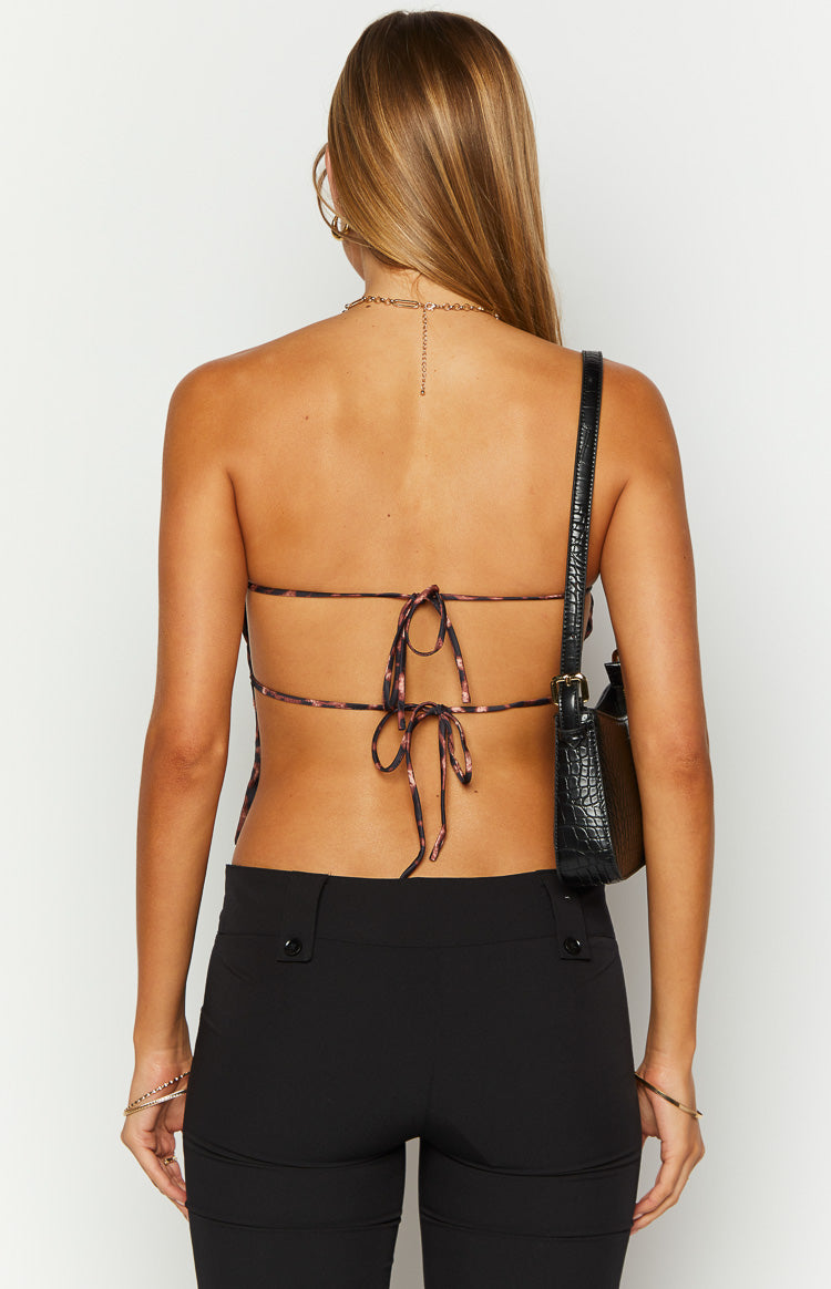 Rear view of a leopard print strapless top with thin tie straps across the open back