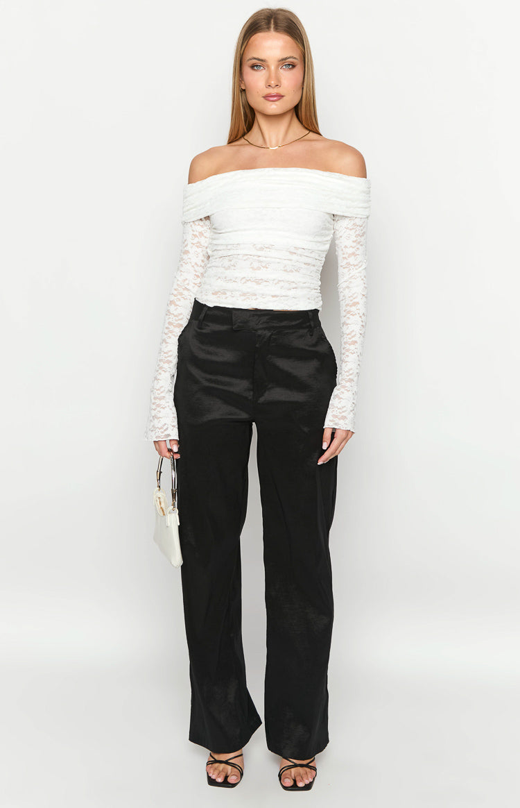 Full-length front view of black wide-leg pants featuring a high waist and a subtle textured sheen
