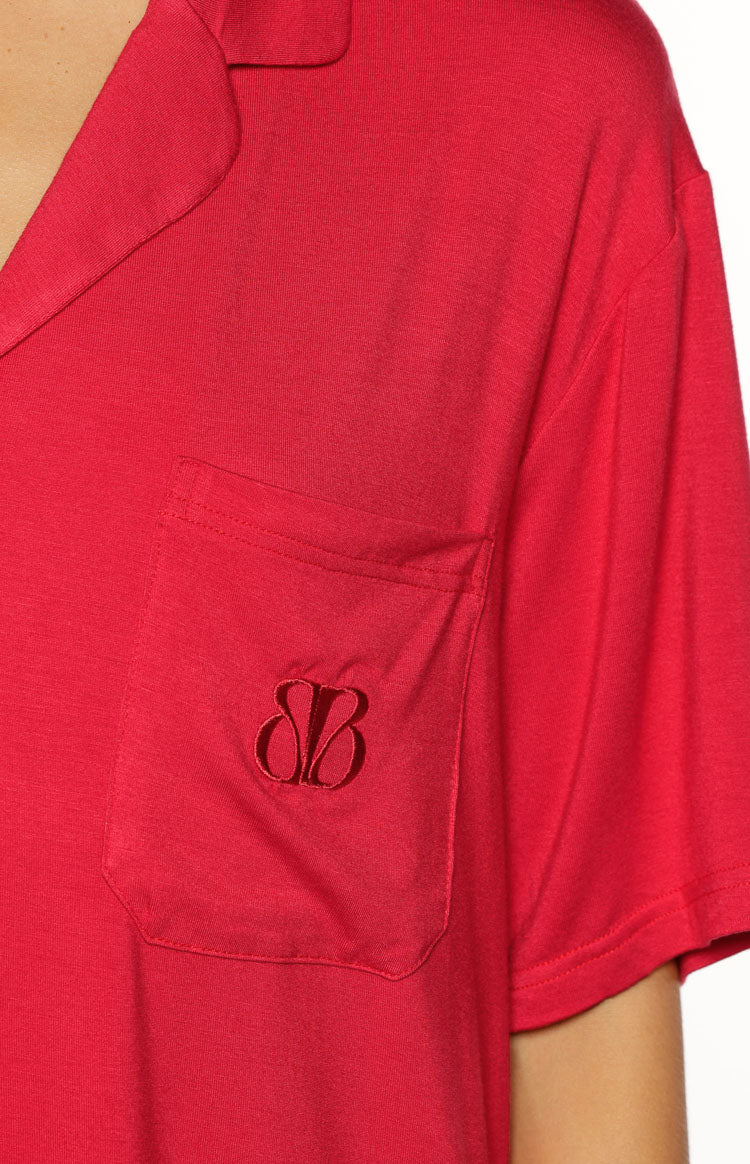 Embroidered BB logo on the chest pocket of a soft burgundy pajama shirt