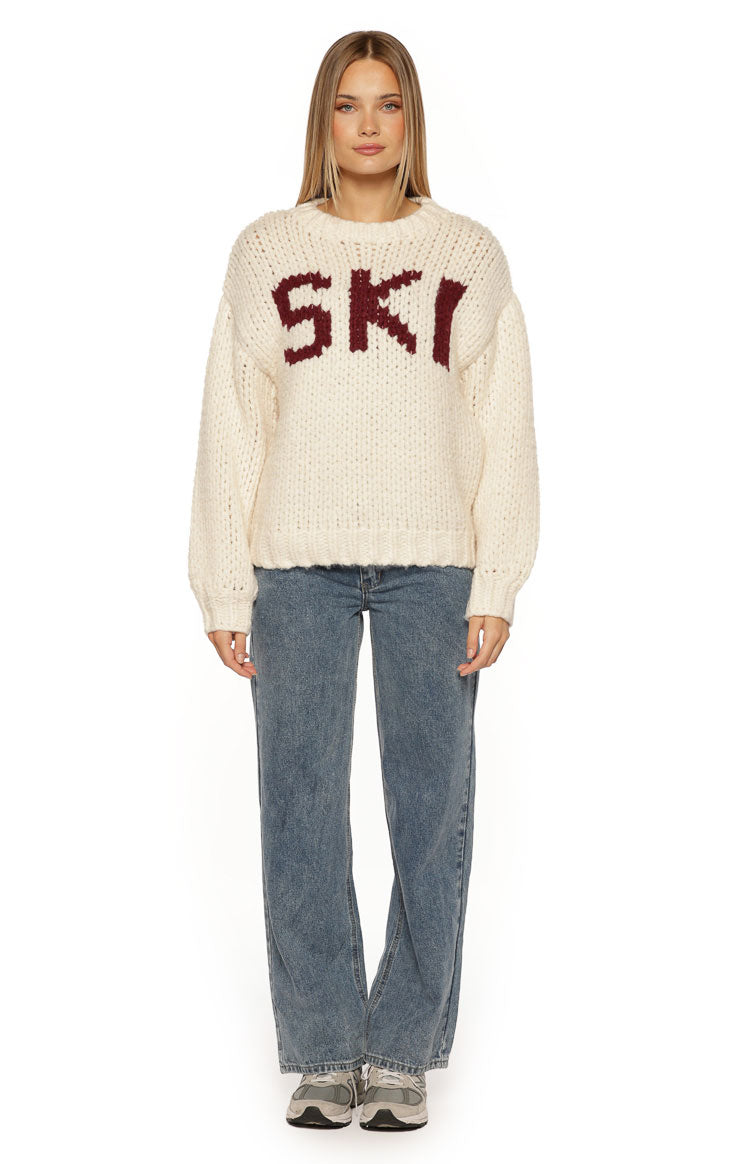 Cream chunky knit sweater with burgundy 'SKI' jacquard lettering and a relaxed fit