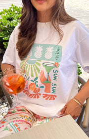 Beginning Boutique Jaz Dolce Vita Print Tee white oversized crew neck tee with a colourful graphic print of pineapples and cocktails