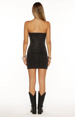 Rear view of a black washed denim strapless mini dress with a back zipper closure
