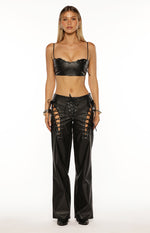 Black PU leather crop top with thin spaghetti straps and a scalloped lace-up neckline