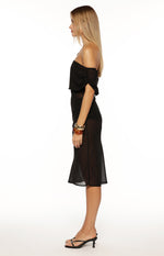 Side view of a black sheer off-the-shoulder midi dress with ruched short sleeves