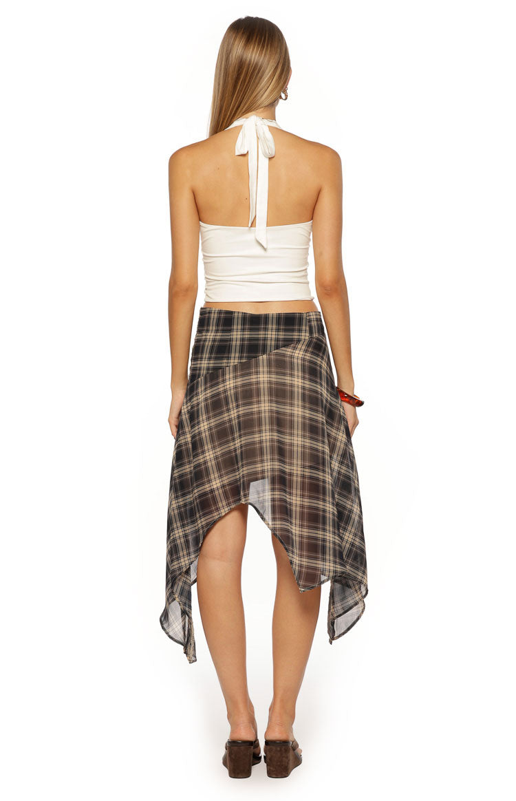 Rear view of a sheer brown and black plaid midi skirt with a hanky hem