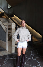 Beige plaid funnel neck jacket with a relaxed fit, voluminous sleeves, and elasticated blouson hem