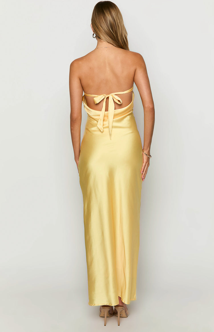 Rear view of a yellow satin maxi dress with a halter neck tie and low back