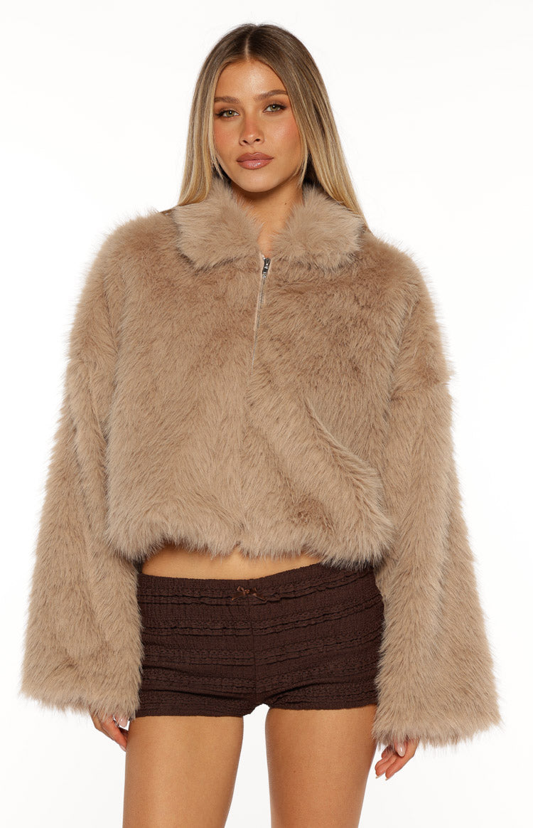 Front view of a light brown faux fur jacket with a collared neckline, full zip, and wide long sleeves