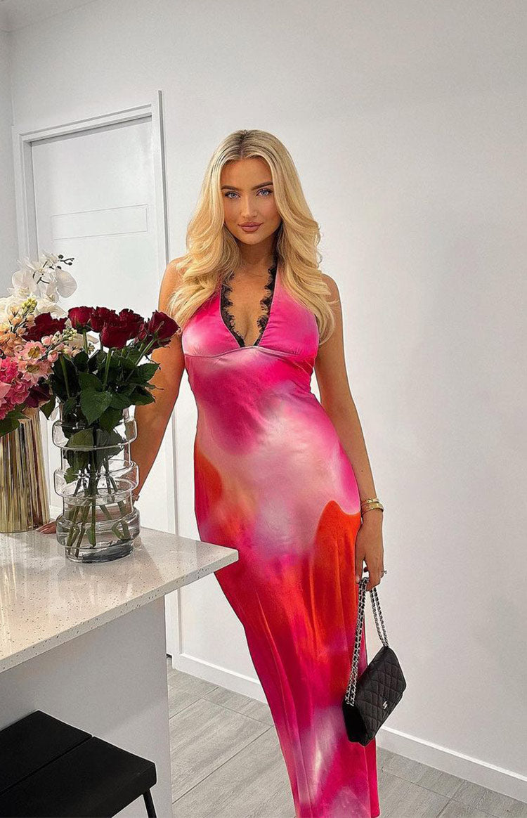 Pink and orange tie-dye halter neck maxi dress with black lace trim along the neckline
