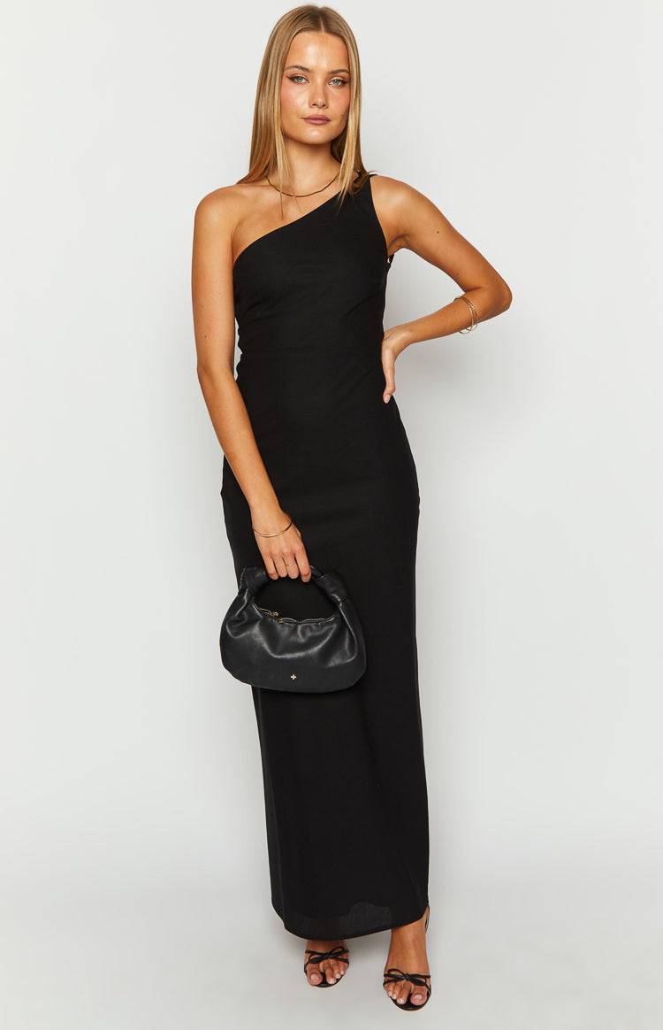 Black one-shoulder maxi dress with a fitted bodice and a long, straight silhouette