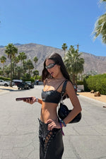 Beginning Boutique Joyner Black PU Leather Crop Top black PU leather fitted crop top with thin spaghetti straps and a ruched