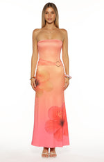 Pink ombre strapless maxi dress with a ruched waist, gold hexagonal ring, and hibiscus print