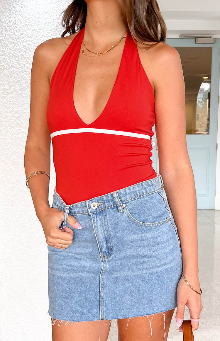 Red halter bodysuit with a deep V-neckline and a white horizontal stripe across the bust